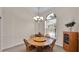 Cozy dining room with a round table and four chairs at 6714 Highlands Creek Loop, Lakeland, FL 33813