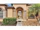 Elegant entryway with double doors and stone accents at 6714 Highlands Creek Loop, Lakeland, FL 33813