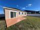 Back of house showing a patio and fenced backyard at 1038 Suffragette Cir, Haines City, FL 33844