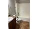 Bathroom includes a toilet, sink, and bathtub at 1038 Suffragette Cir, Haines City, FL 33844