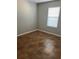 Bright bedroom with tile flooring and window blinds at 1038 Suffragette Cir, Haines City, FL 33844