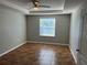 Well lit bedroom with ceiling fan and tile floor at 1038 Suffragette Cir, Haines City, FL 33844