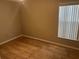 Simple bedroom with tile flooring and window at 1041 Heron Ct, Kissimmee, FL 34759