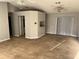 Open living room with tile floors and a kitchen pass-through at 1041 Heron Ct, Kissimmee, FL 34759