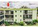 Back view of condo building with garden at 1130 N Lake Parker Ave # A202, Lakeland, FL 33805