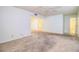 Living room with carpet, access to other rooms, and ceiling fan at 1130 N Lake Parker Ave # A202, Lakeland, FL 33805