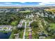 A beautiful aerial view of a residential neighborhood with lush greenery and blue skies above at 123 Padgett N Pl, Lakeland, FL 33809