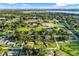 Lush, green aerial view of a residential area showcasing neighborhood homes and mature trees at 123 Padgett N Pl, Lakeland, FL 33809