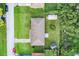 Bird's-eye view of home showing roof and backyard with shed and lush greenery at 123 Padgett N Pl, Lakeland, FL 33809