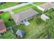 Aerial view of a house featuring a spacious backyard, shed, gazebo, and mature trees at 123 Padgett N Pl, Lakeland, FL 33809