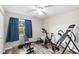 Bright bedroom with workout equipment and a large window at 123 Padgett N Pl, Lakeland, FL 33809