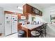 Kitchen area with breakfast bar and wood cabinetry at 123 Padgett N Pl, Lakeland, FL 33809