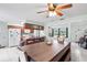 Open eat-in kitchen area with wooden cabinets, a breakfast bar, and view into other rooms at 123 Padgett N Pl, Lakeland, FL 33809