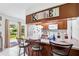 Kitchen area with wooden breakfast bar and barstool seating at 123 Padgett N Pl, Lakeland, FL 33809