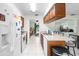 Kitchen area with breakfast bar adjacent to entryway and living room area at 123 Padgett N Pl, Lakeland, FL 33809