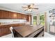 Kitchen area with wooden cabinets, a large table, and views of the backyard at 123 Padgett N Pl, Lakeland, FL 33809