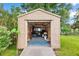 Exterior view of shed with an open door, revealing ample storage space at 123 Padgett N Pl, Lakeland, FL 33809