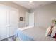 Cozy bedroom with soft lighting, a comfortable bed, and double door closet at 127 W Belmar St, Lakeland, FL 33803