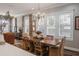 Bright dining room with large windows, wood floors, and stylish chandelier at 127 W Belmar St, Lakeland, FL 33803