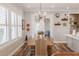 Charming dining room with wood floors, natural light and elegant chandelier at 127 W Belmar St, Lakeland, FL 33803