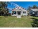 Charming gray home with a well-manicured lawn and cozy front porch at 127 W Belmar St, Lakeland, FL 33803