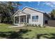 Charming single-story home with a welcoming front porch and well-manicured lawn at 127 W Belmar St, Lakeland, FL 33803