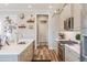 Well-lit kitchen with modern appliances, and a view into the hallway at 127 W Belmar St, Lakeland, FL 33803