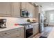 Modern kitchen featuring stainless steel appliances, custom cabinets, and stylish backsplash at 127 W Belmar St, Lakeland, FL 33803