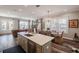 Open concept kitchen with island, flowing into the dining and living areas with lots of natural light at 127 W Belmar St, Lakeland, FL 33803