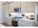 Stylish kitchen with stainless steel appliances and white subway tile backsplash at 127 W Belmar St, Lakeland, FL 33803