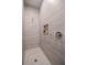 Modern walk-in shower with sleek tile, a built-in niche, and a rainfall shower head at 127 W Belmar St, Lakeland, FL 33803