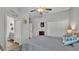 Bedroom featuring ensuite bathroom, double door closet, ceiling fan and neutral colored walls and decor at 1336 Melrose St, Lake Alfred, FL 33850