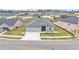 Aerial view of a modern, light-grey home with well-kept lawn at 1336 Melrose St, Lake Alfred, FL 33850