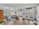 Living room with a neutral color palette, modern lighting, and french doors at 1336 Melrose St, Lake Alfred, FL 33850