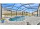 Screened in pool with pavers and water feature at 1336 Melrose St, Lake Alfred, FL 33850