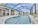 Refreshing screened pool surrounded by a paver patio at 1336 Melrose St, Lake Alfred, FL 33850