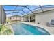 Enclosed pool area with covered patio at 1336 Melrose St, Lake Alfred, FL 33850