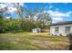 Large backyard with shed and trees at 1418 Grace N St, Lakeland, FL 33810