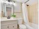 Clean bathroom with a shower/tub combo and white vanity at 1418 Grace N St, Lakeland, FL 33810