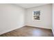 Simple bedroom with a window and wood-look flooring at 1418 Grace N St, Lakeland, FL 33810