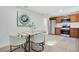 Bright dining area with a wood table and four light-grey chairs at 1418 Grace N St, Lakeland, FL 33810