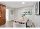 Dining area with wood table and four chairs, near kitchen at 1418 Grace N St, Lakeland, FL 33810