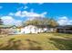 Back of house with large backyard and shed at 1418 Grace N St, Lakeland, FL 33810