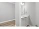 Modern powder room with white vanity and quartz countertop at 1427 Magnolia Ln, Auburndale, FL 33823