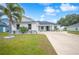 Two-story house exterior with stone accents and landscaping at 1427 Magnolia Ln, Auburndale, FL 33823