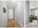 Light and airy hallway with wood-look flooring at 1427 Magnolia Ln, Auburndale, FL 33823