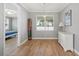 Home office with hardwood floors, white cabinetry, and large window at 1427 Magnolia Ln, Auburndale, FL 33823