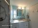 Updated bathroom with granite countertop and walk-in shower at 1540 Skyview Ct, Lakeland, FL 33801