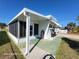 Side view of the home with additional screened porch at 1540 Skyview Ct, Lakeland, FL 33801