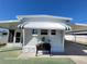 Front view of a white mobile home with awning at 1540 Skyview Ct, Lakeland, FL 33801